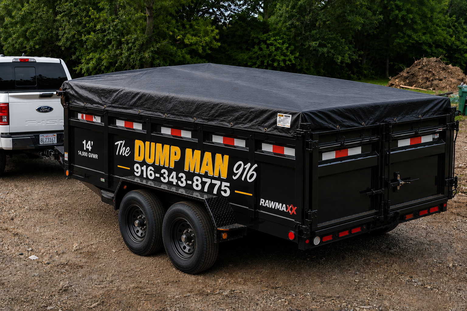 The Dump Man 916 dump trailer hitched to a Ford truck
